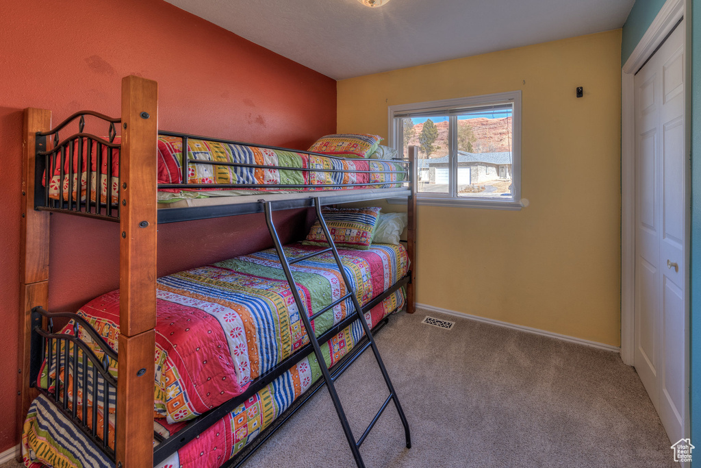 Bedroom with carpet and baseboards
