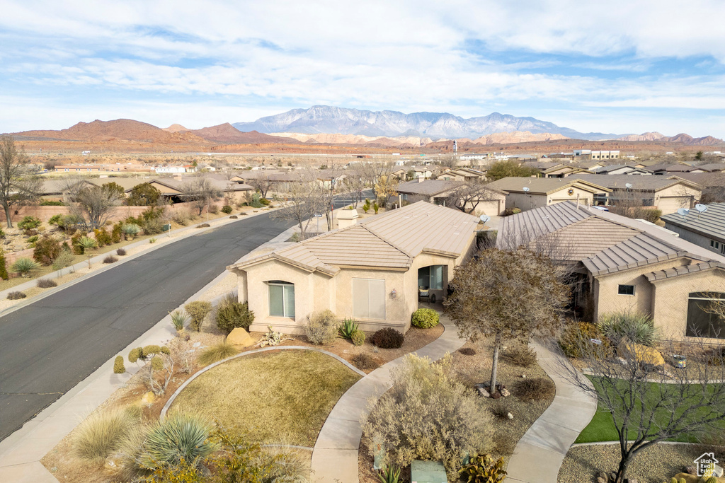 Aerial perspective of suburban area with a mountain backdrop