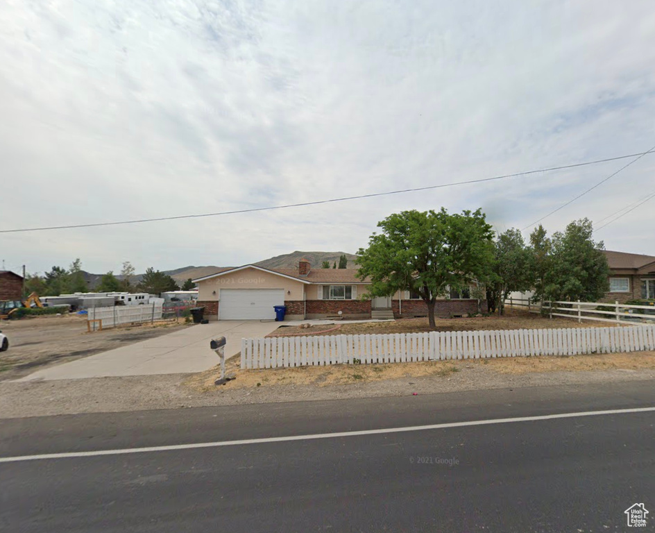 View of front of home featuring a garage