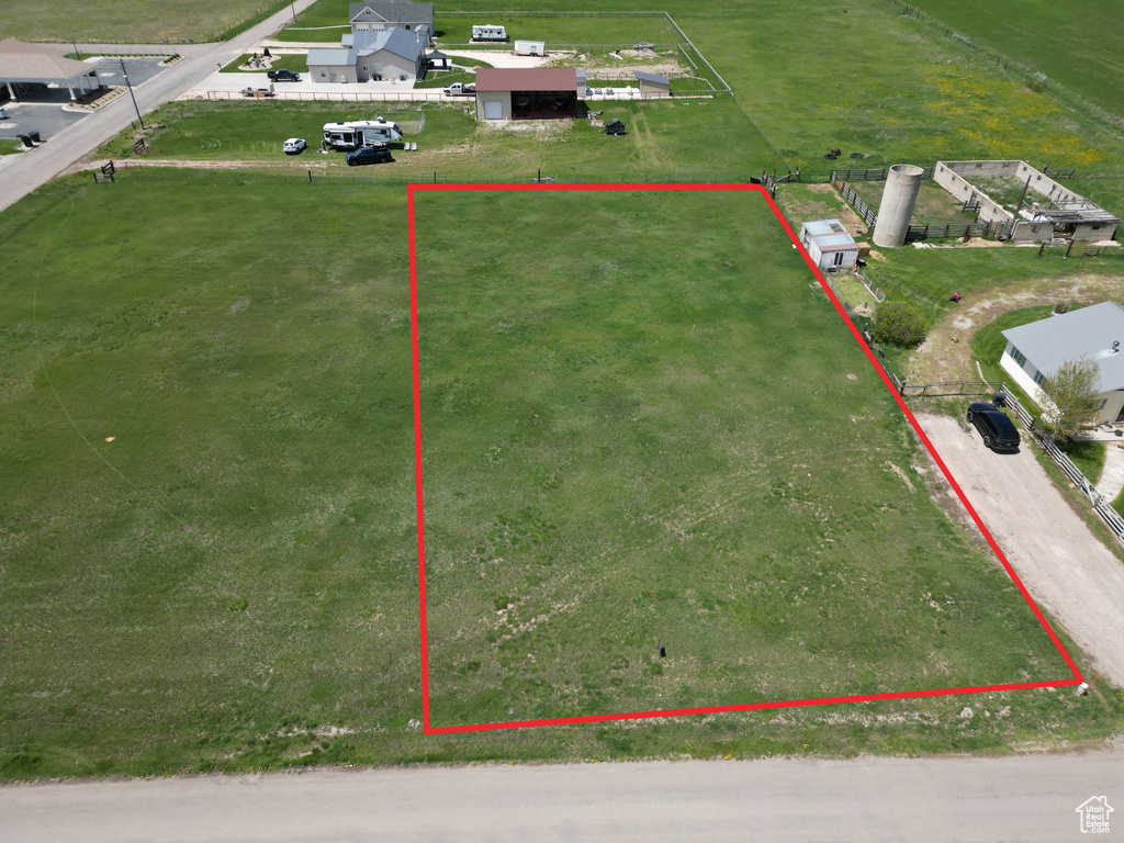 Aerial view of property and surrounding area with property parcel outlined