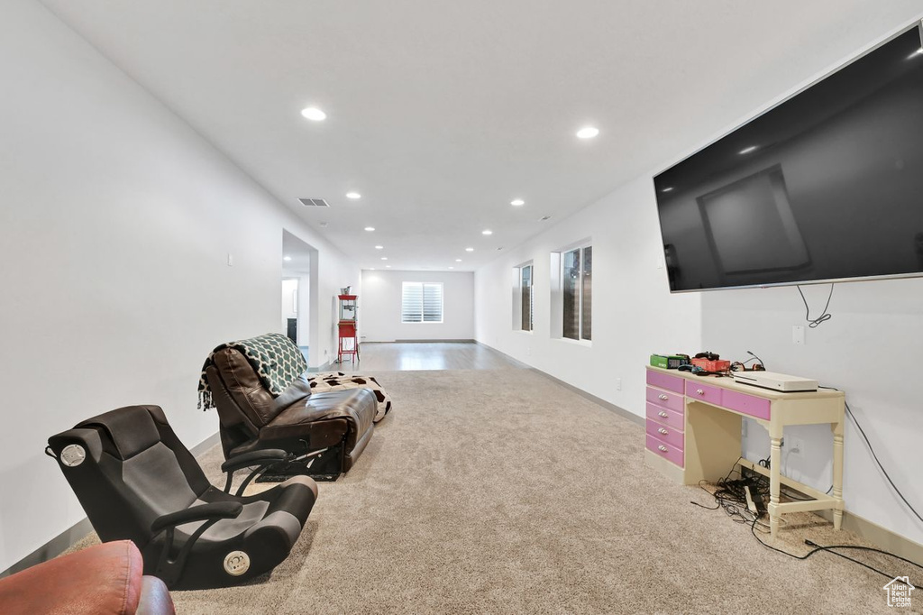 Sitting room featuring carpet flooring