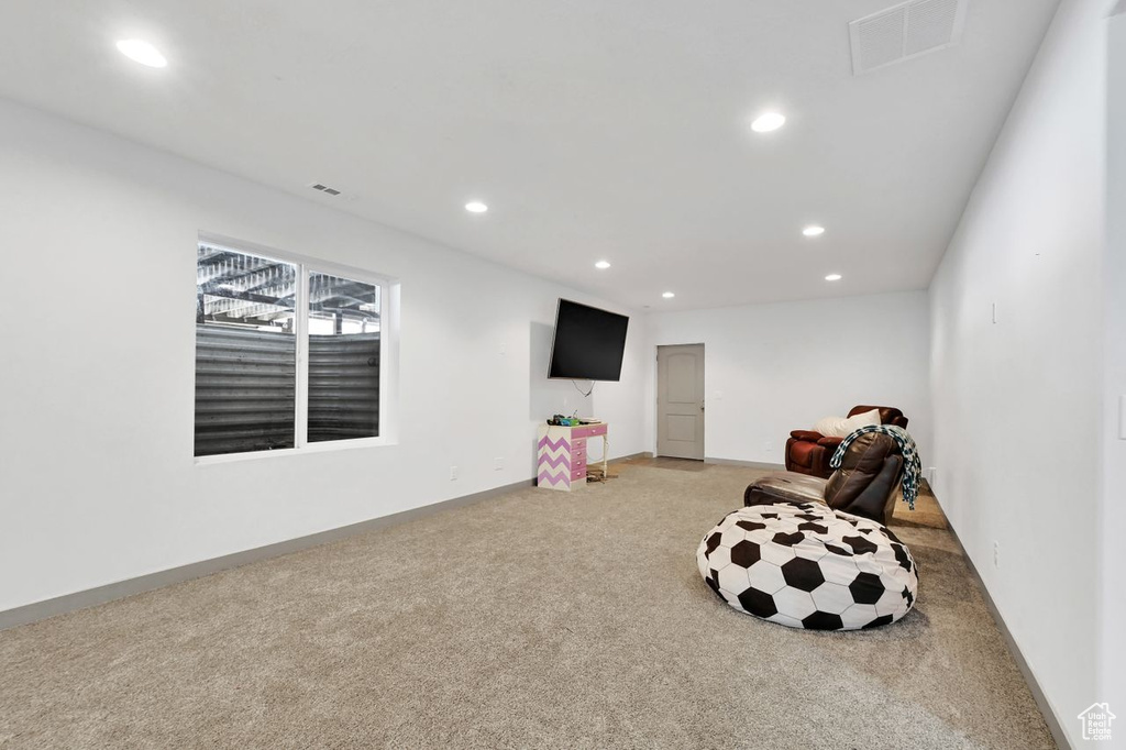 Living area featuring carpet flooring