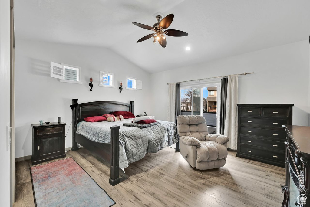 Bedroom with vaulted ceiling, access to outside, ceiling fan, and light hardwood / wood-style flooring