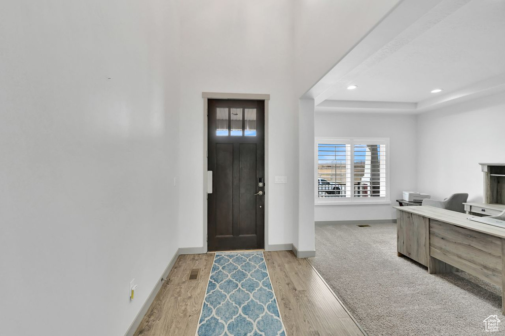 Foyer featuring light wood-type flooring