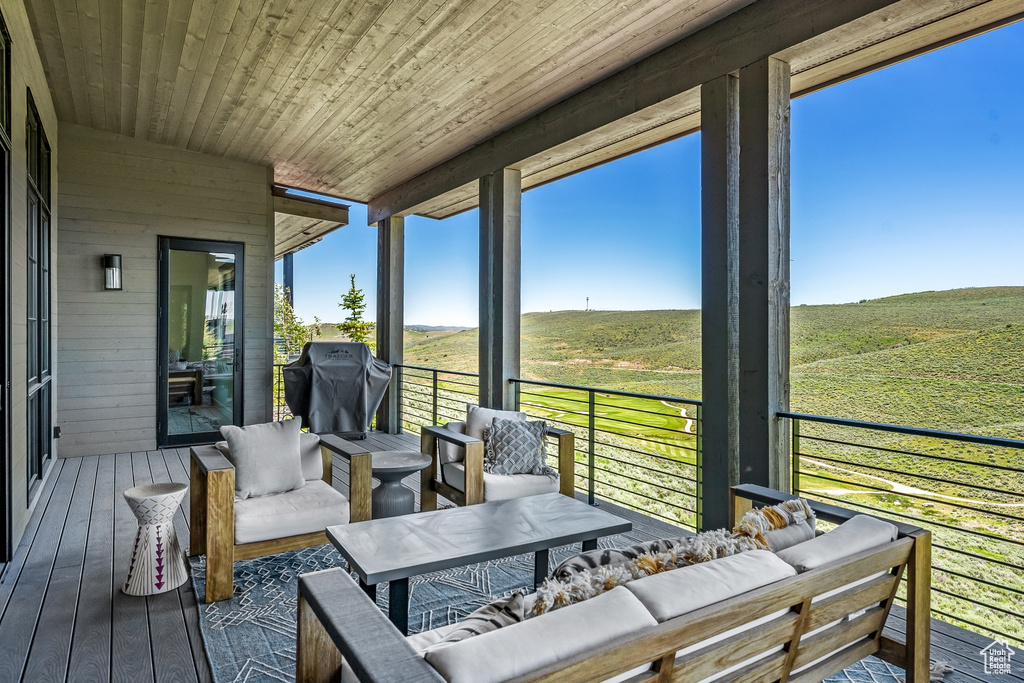 Sunroom / solarium featuring outdoor lounge area and a rural view