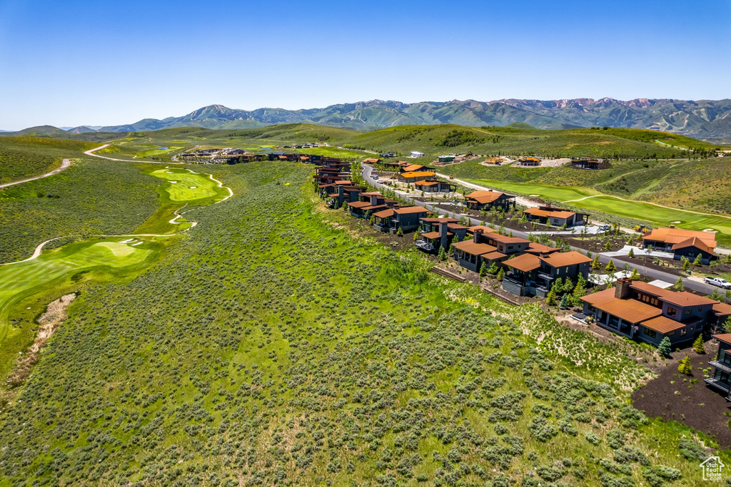 Bird's eye view featuring golf course view, a mountain view, and a residential view
