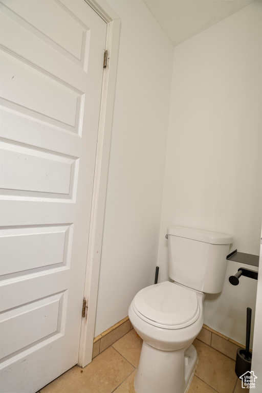 Bathroom with tile patterned floors and toilet