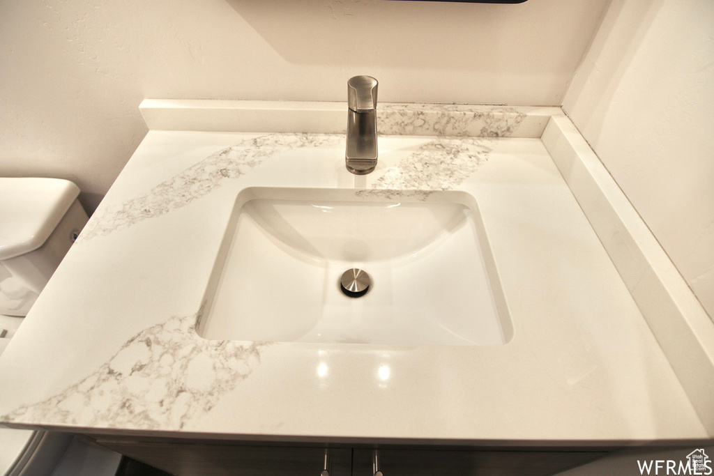 Interior details featuring toilet and sink