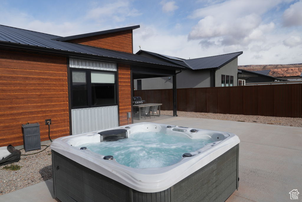 View of patio / terrace featuring a hot tub