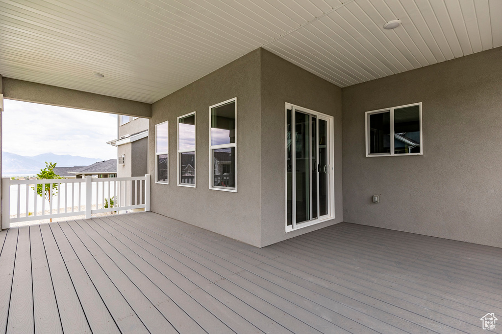 Wooden terrace featuring a mountain view