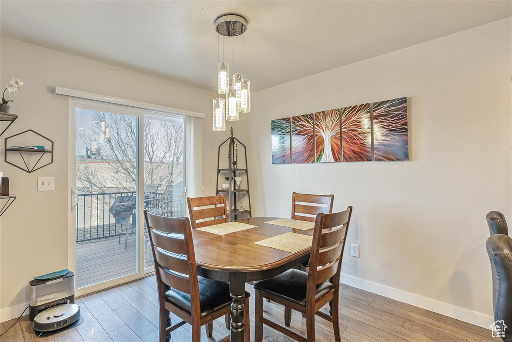 Dining area with wood-type flooring