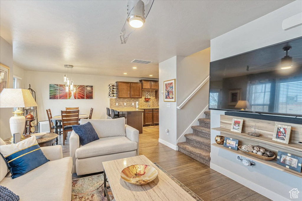 Living room with light wood-type flooring