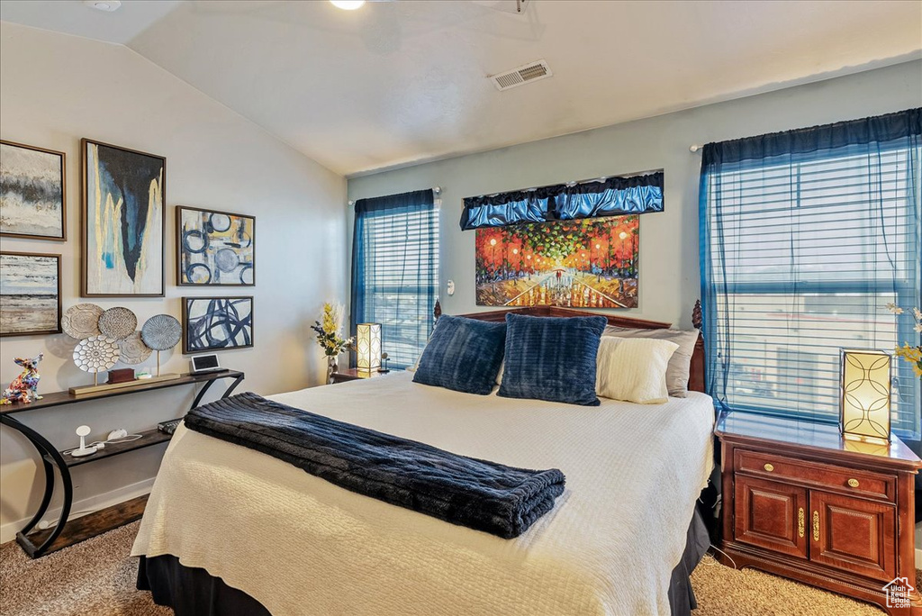 Bedroom featuring lofted ceiling and ceiling fan