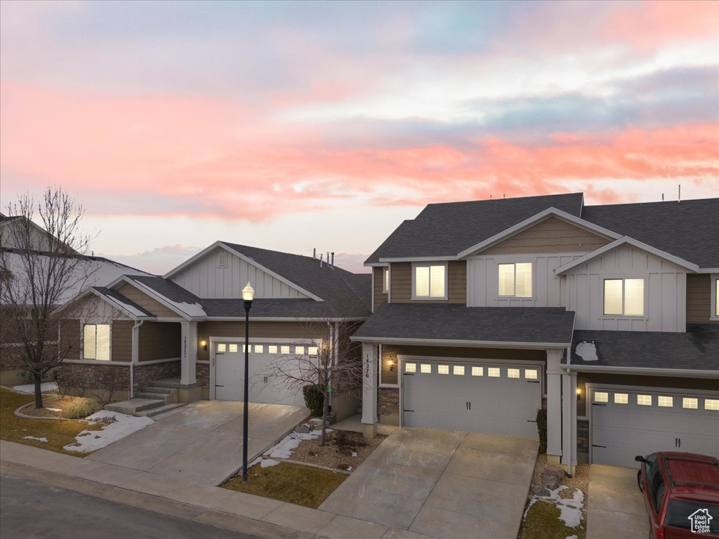 View of front of property featuring a garage