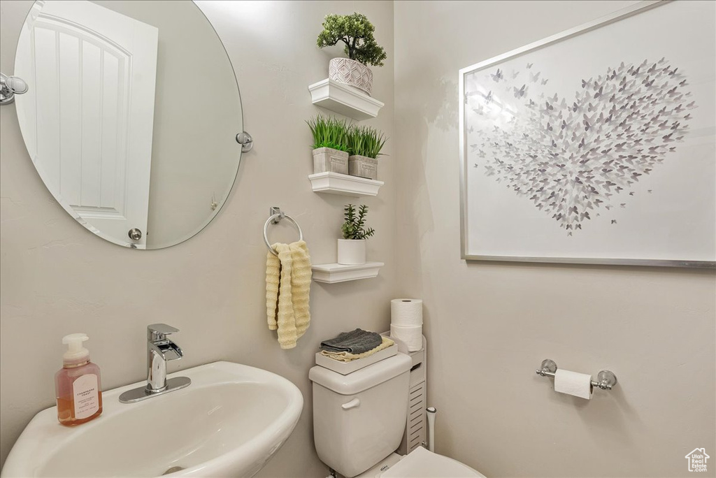 Bathroom with sink and toilet