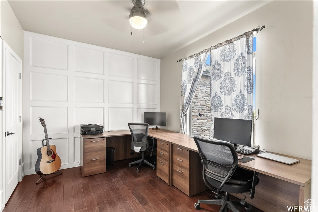 Office featuring ceiling fan and dark hardwood / wood-style flooring