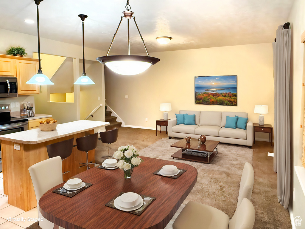 Dining room with light colored carpet