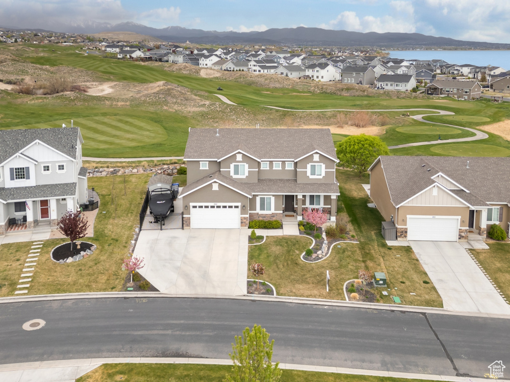 Drone / aerial view featuring golf course view, a residential view, and a water and mountain view