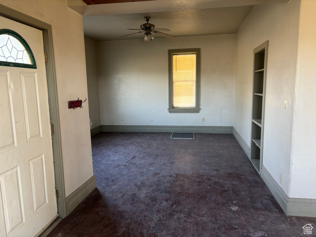 Interior space featuring plenty of natural light, baseboards, and a ceiling fan