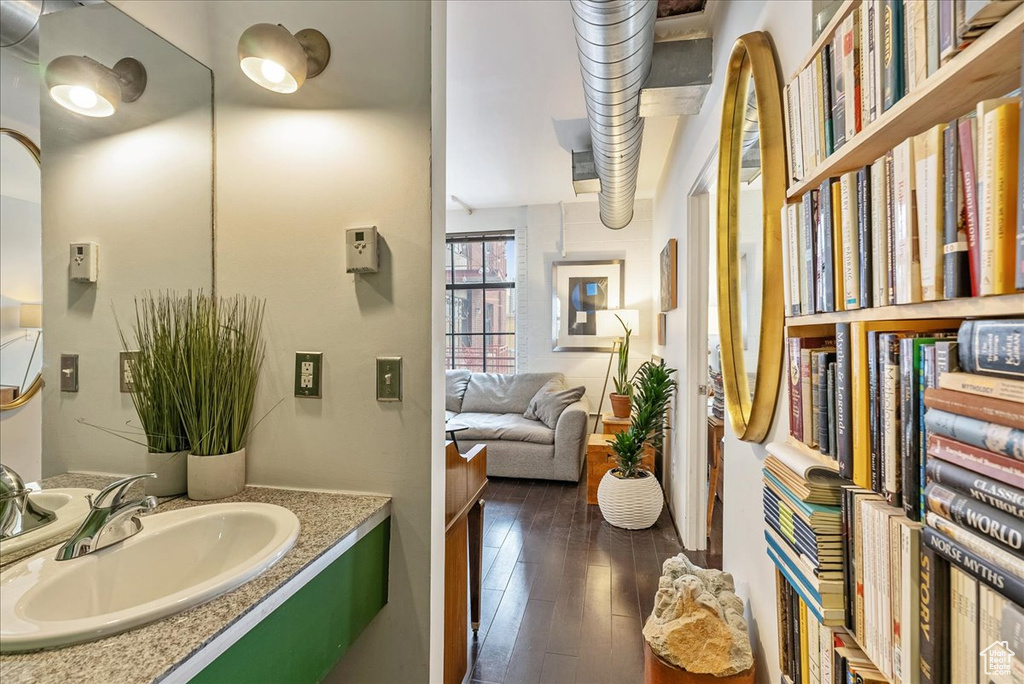 Bathroom featuring hardwood / wood-style flooring and vanity