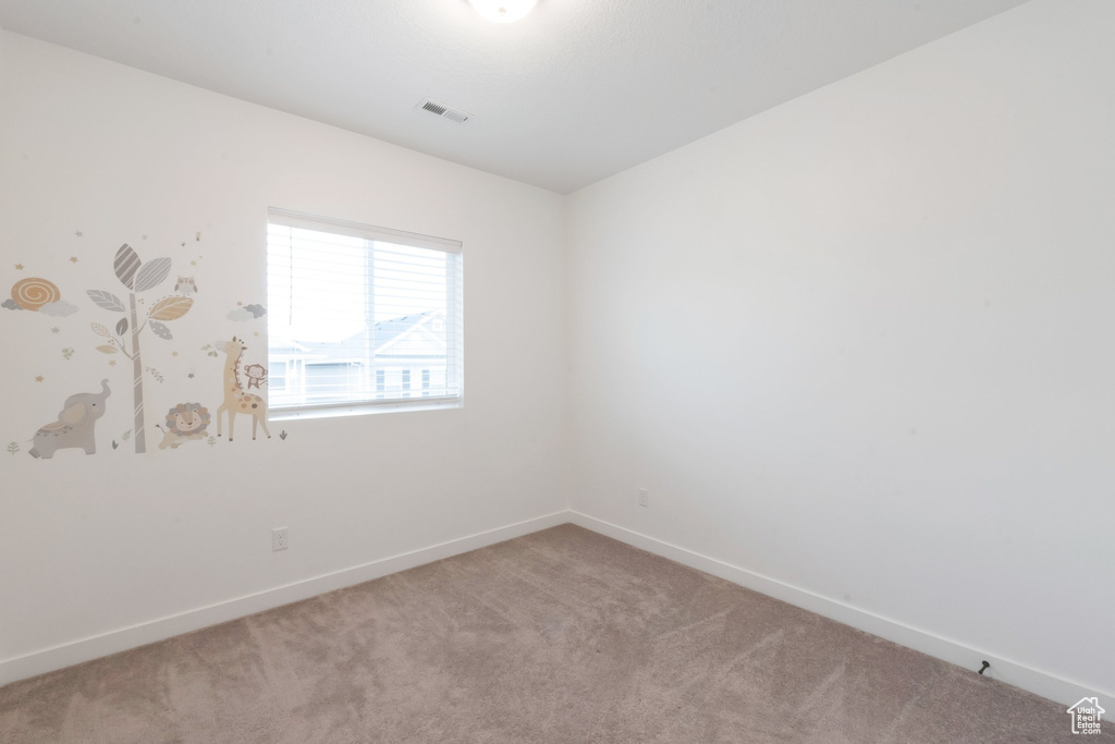 Empty room featuring carpet floors