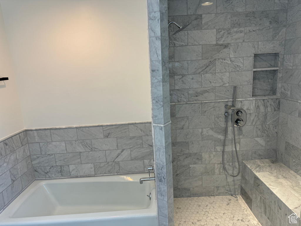 Bathroom with shower with separate bathtub