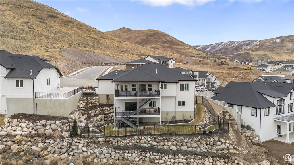 Back of property featuring a mountain view