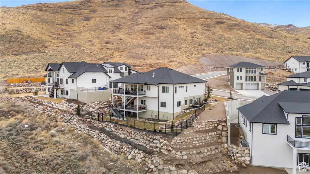 Birds eye view of property with a mountain view