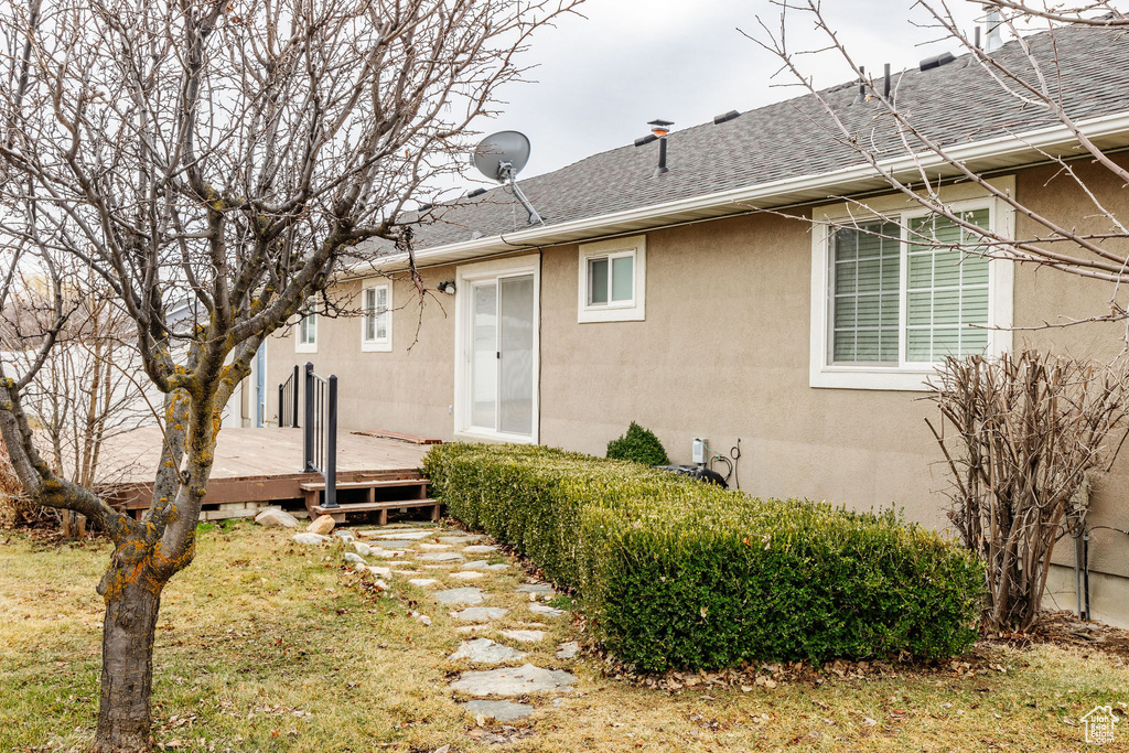 Back of property featuring a deck