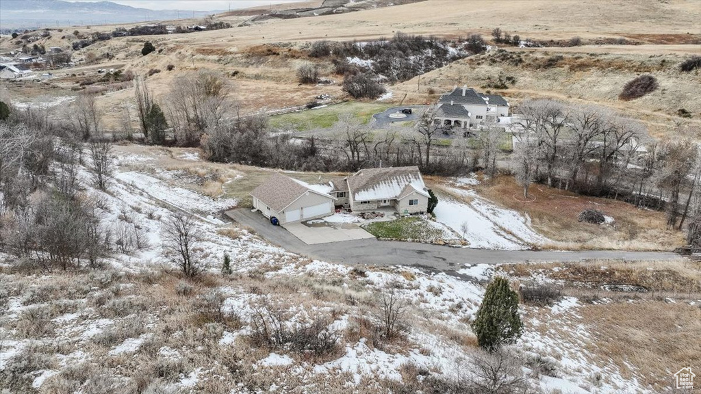 Snowy aerial view with a rural view