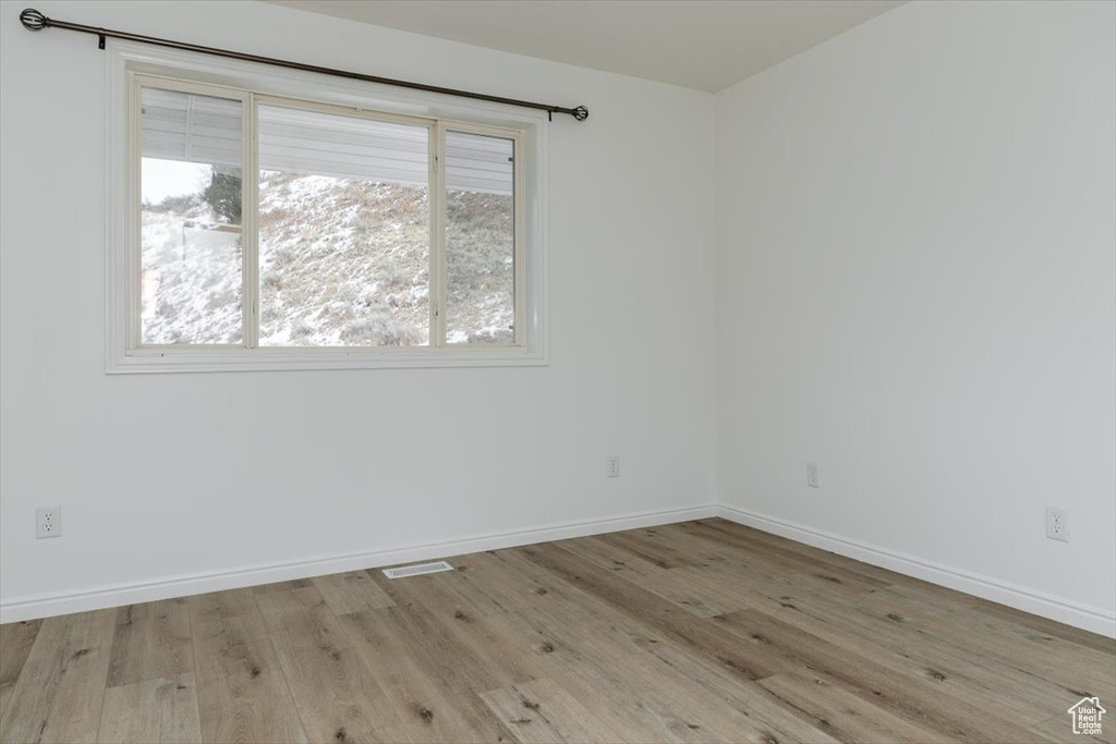 Empty room featuring light hardwood / wood-style floors