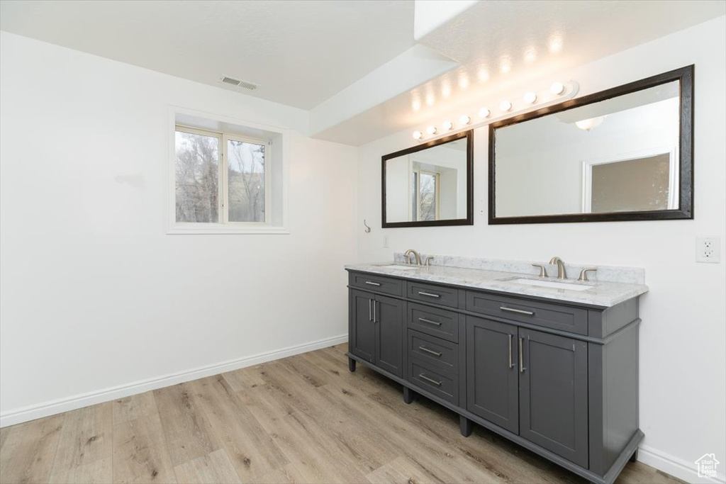 Bathroom featuring vanity and hardwood / wood-style flooring