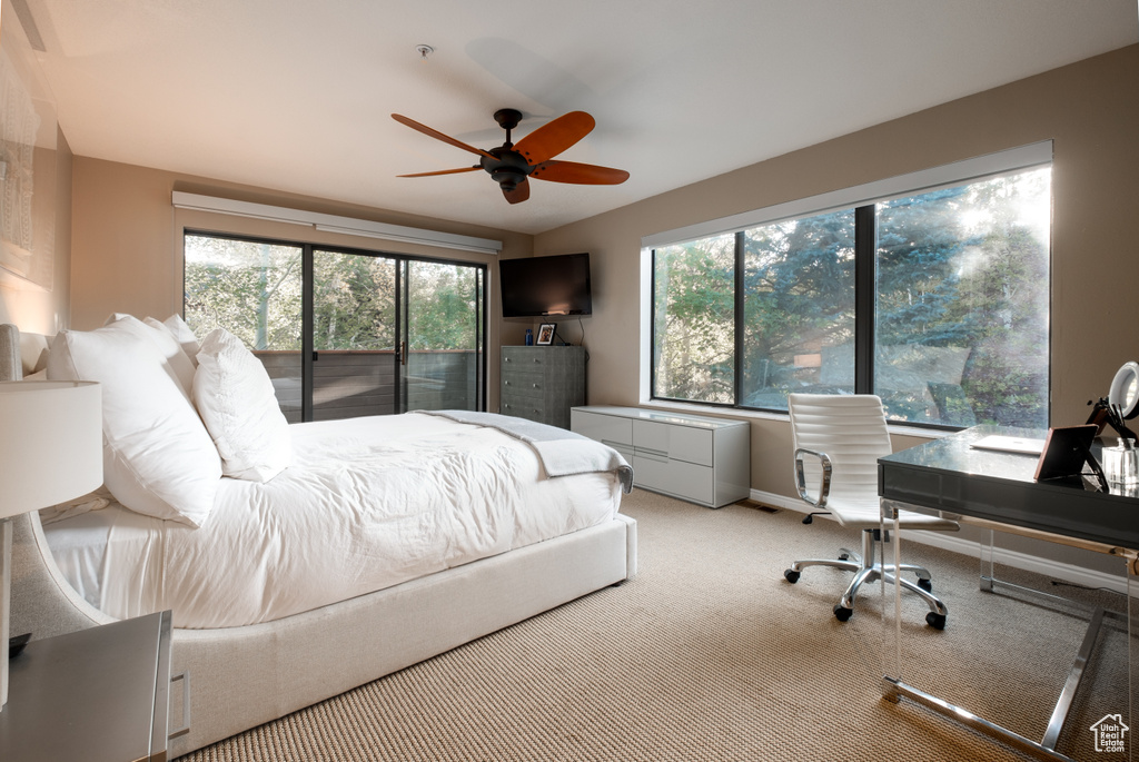 Bedroom featuring light carpet and ceiling fan