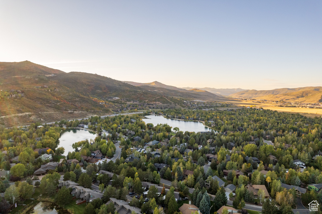Aerial view at dusk with a water and mountain view