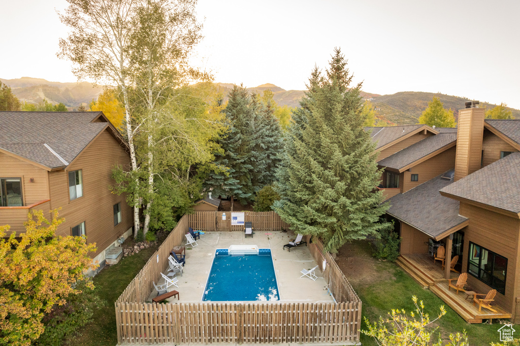 View of swimming pool with a mountain view
