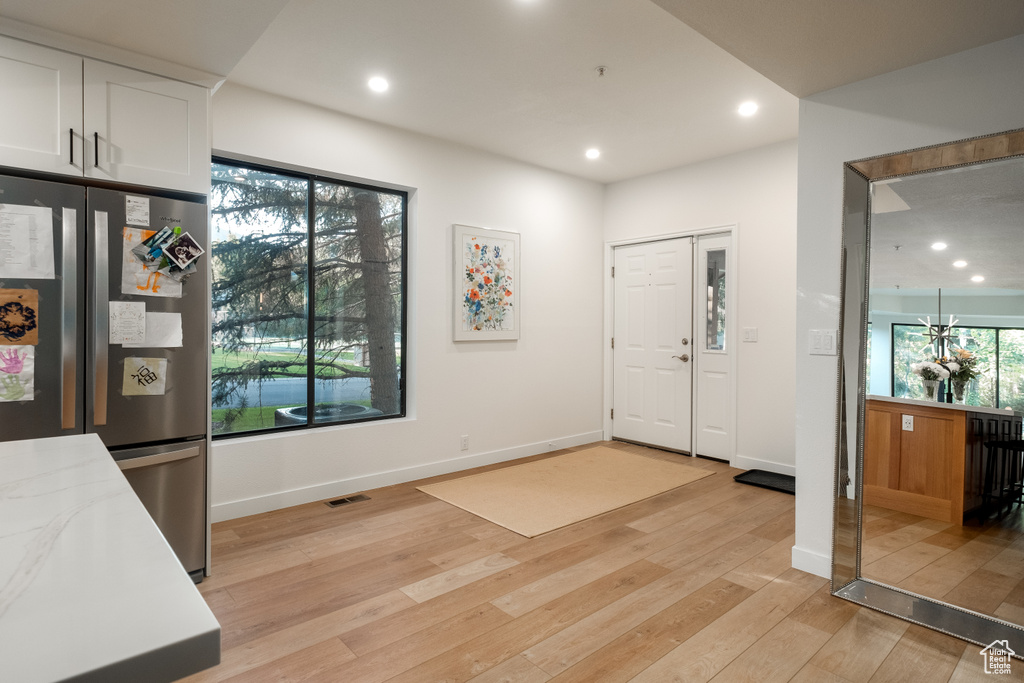 Entrance foyer featuring light wood-type flooring