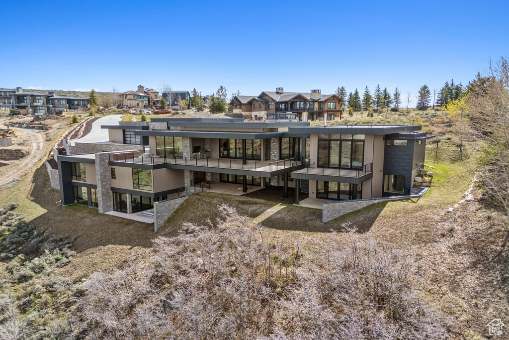 Back of property featuring a residential view