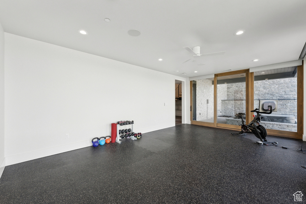 Workout area with baseboards, recessed lighting, and ceiling fan