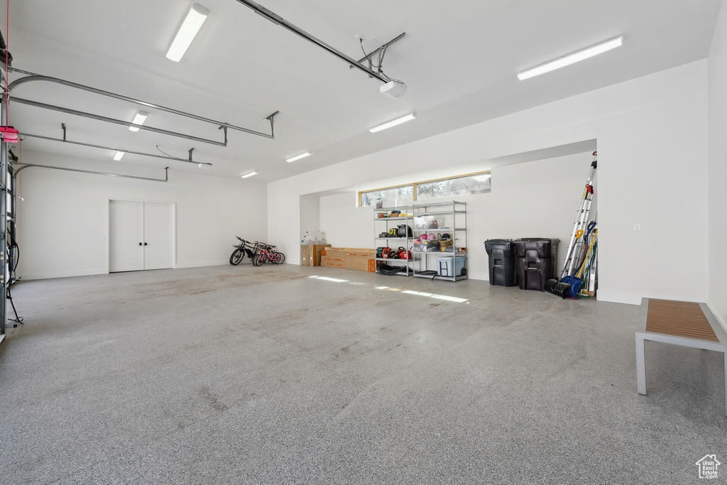 Garage featuring a garage door opener
