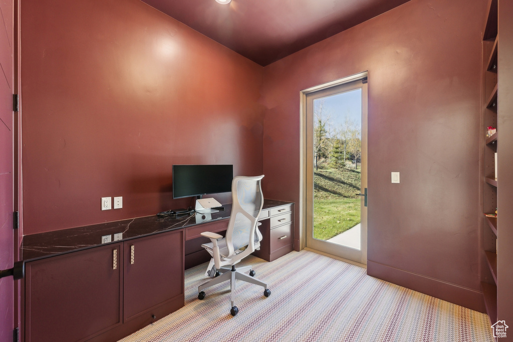 Office space with light colored carpet