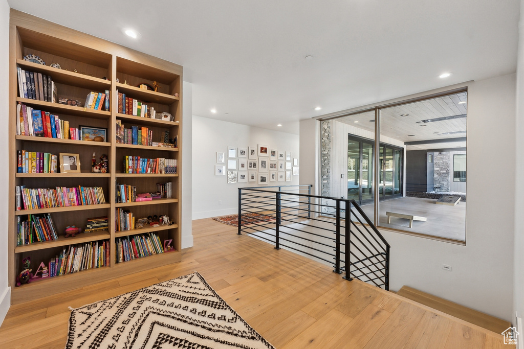 Corridor with light hardwood / wood-style floors