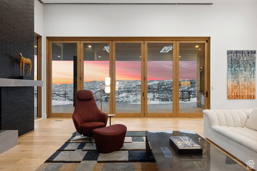 Living room with light hardwood / wood-style flooring