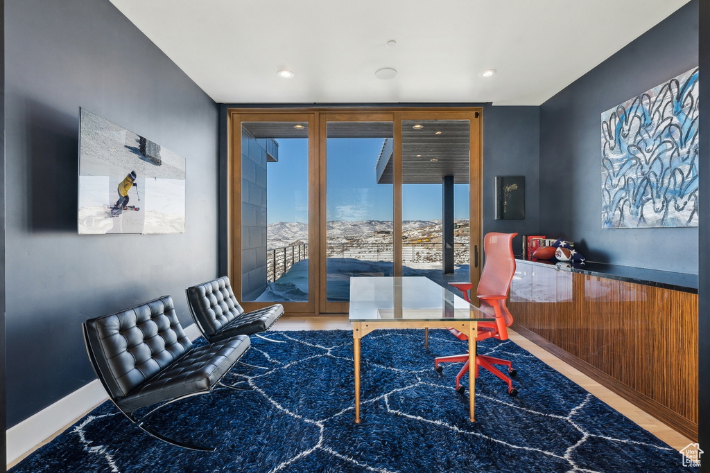 Interior space with a wall of windows and wooden walls