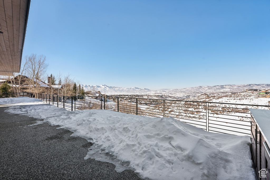 Snowy yard with a mountain view