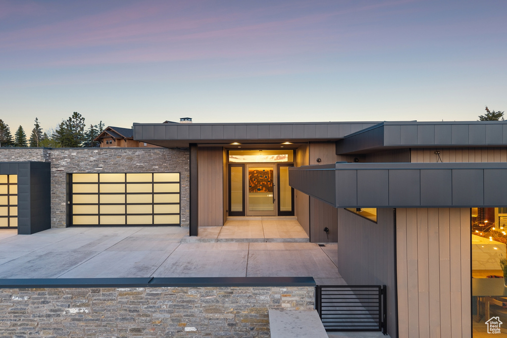 Modern home with an attached garage and driveway