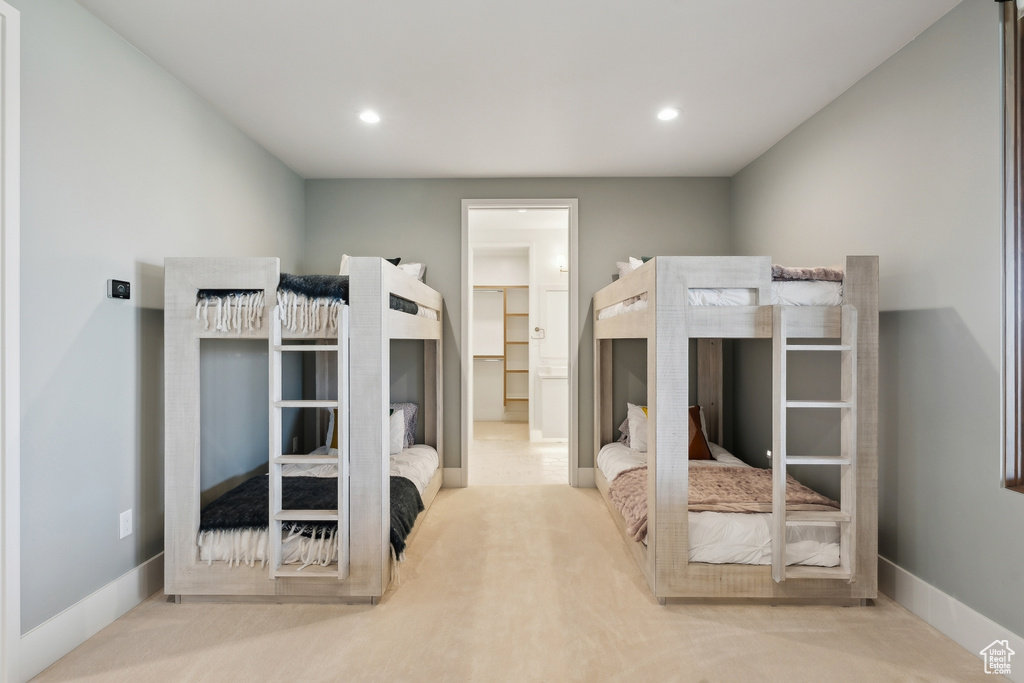 Unfurnished bedroom with baseboards, recessed lighting, carpet floors, and ensuite bathroom