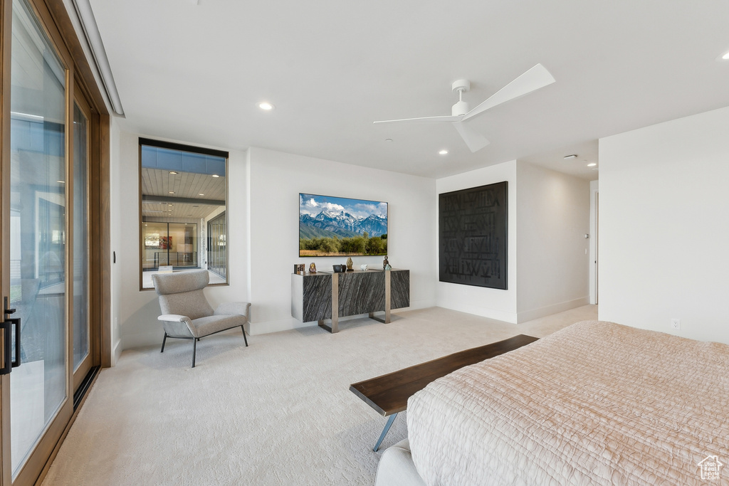 Bedroom with light carpet, recessed lighting, and a ceiling fan