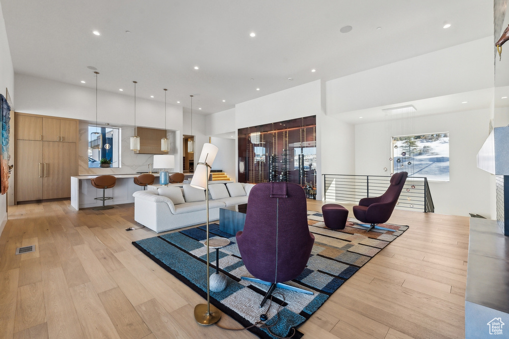 Living room with light hardwood / wood-style floors