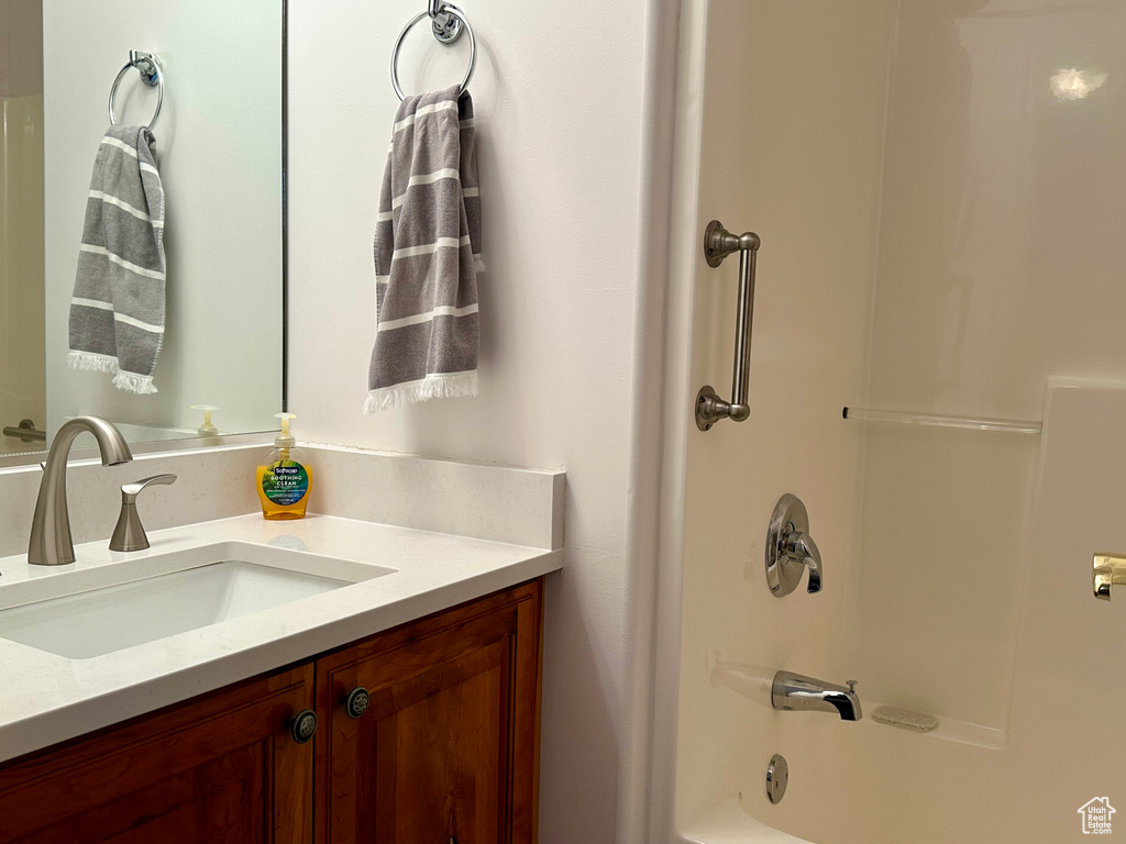 Bathroom with shower / bath combination and vanity