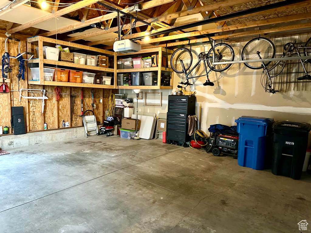 Garage featuring a garage door opener